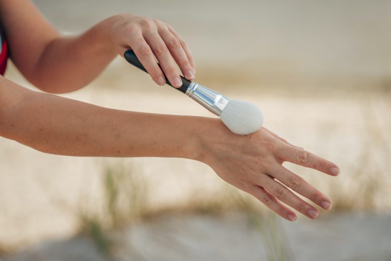 Woman Brushing Hand