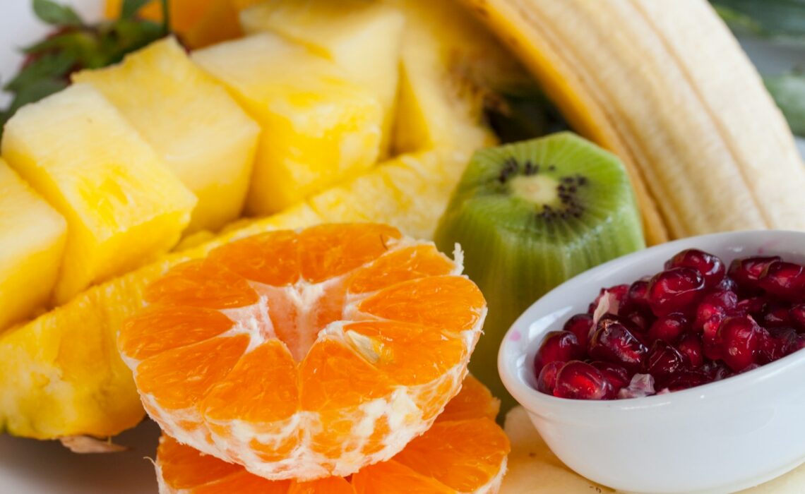 sliced orange fruit on white ceramic bowl